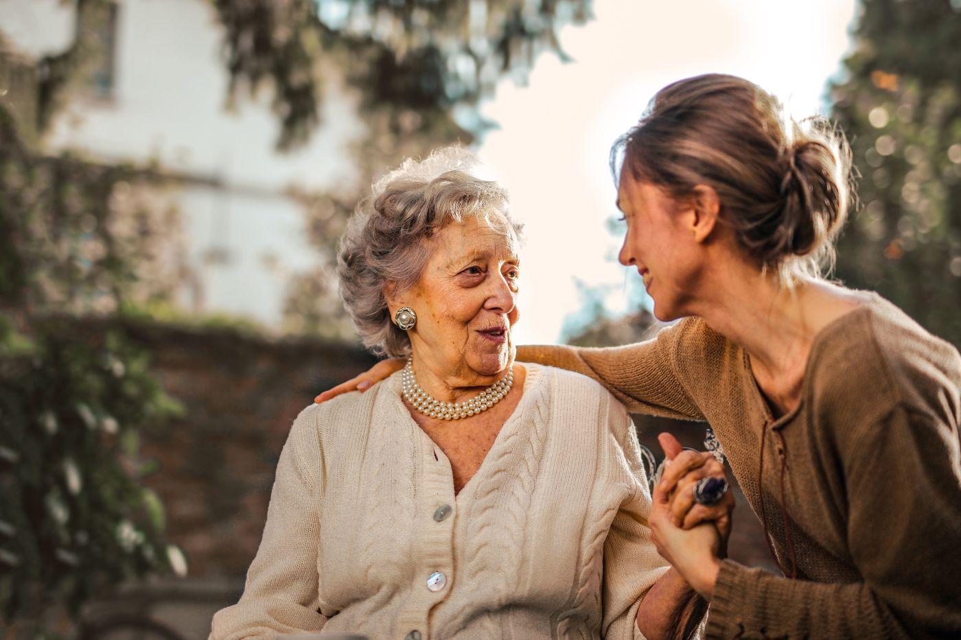 Younger woman embracing older woman