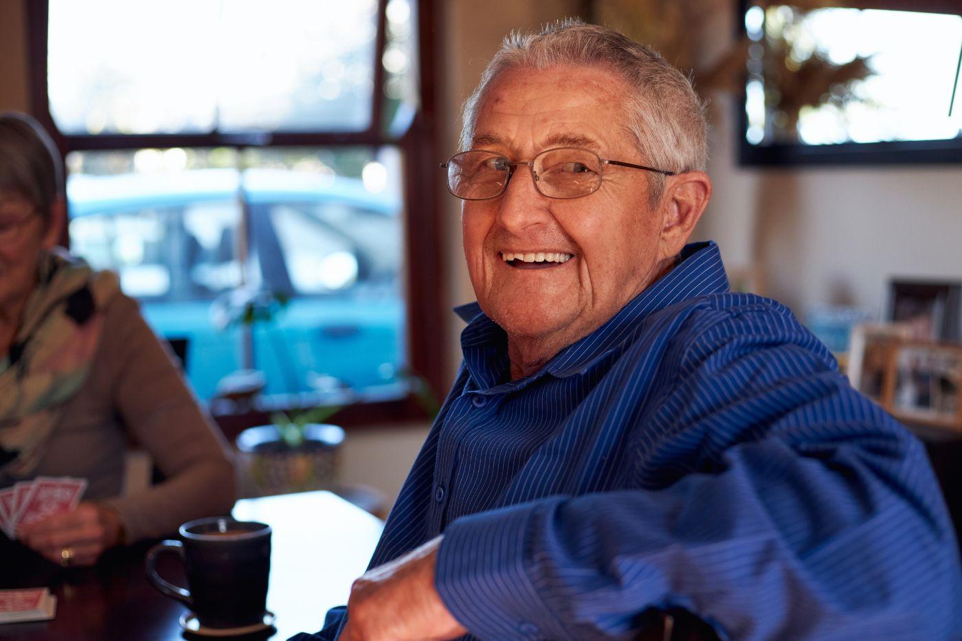 Man looking over shoulder and smiling