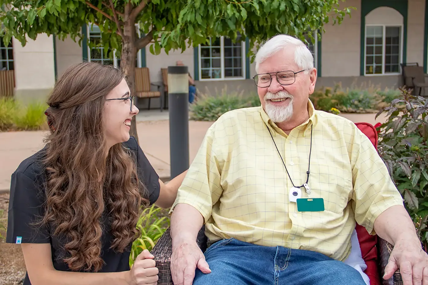 Staff member with an elderly participant.
