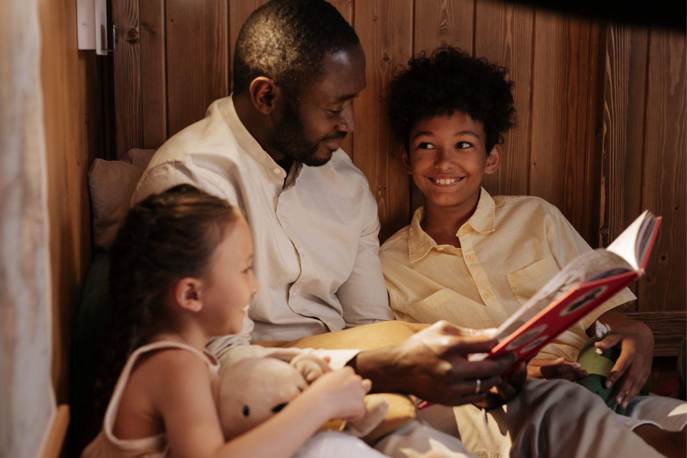 Man reading to his children
